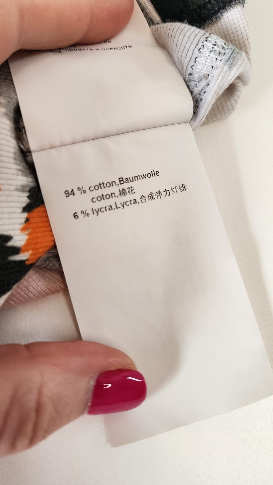 Style Reset dress fabric care label showing 94 percent cotton and 6 percent Lycra composition