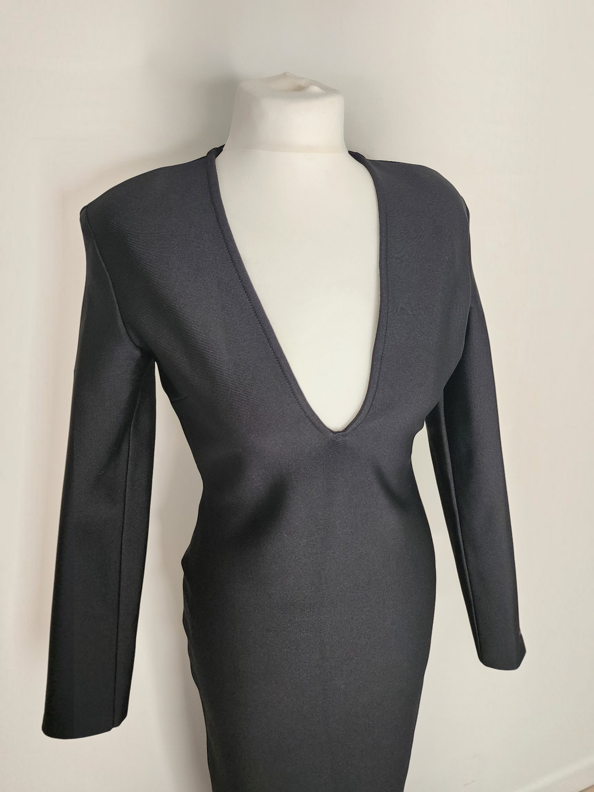 Style Reset Karen Millen black long-sleeved structured dress with a deep V-neckline on a mannequin