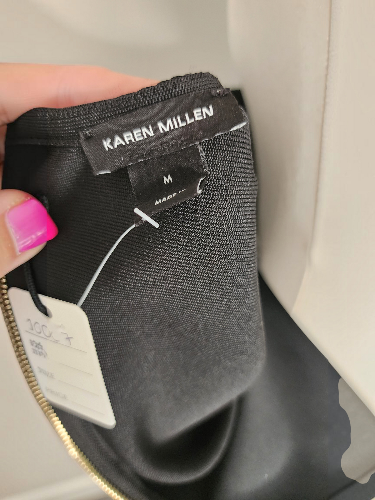 Style Reset Karen Millen black structured dress label showing size M and fabric texture