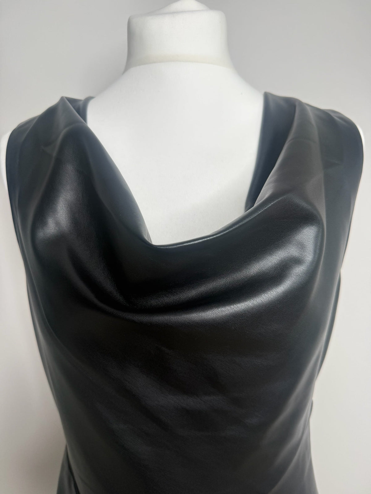 Style Reset FRENCH CONNECTION black faux leather sleeveless midi dress with a draped cowl neckline on a mannequin
