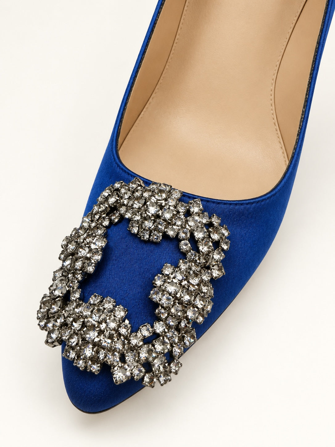 Style Reset royal blue satin stiletto court shoes featuring a pointed toe and a large, sparkling crystal buckle.