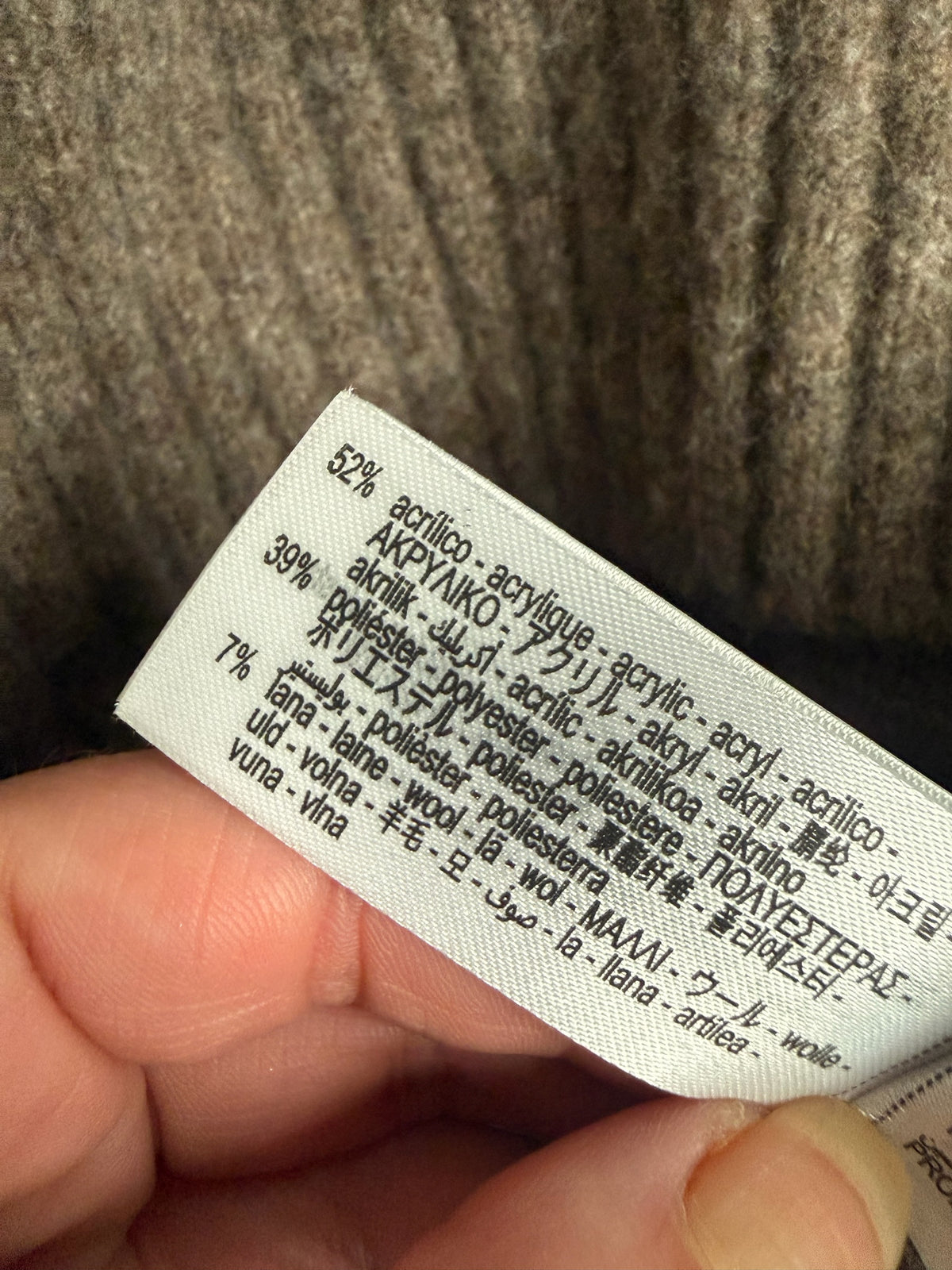 Style Reset brown knitted jumper fabric composition label showing acrylic polyester and wool blend details
