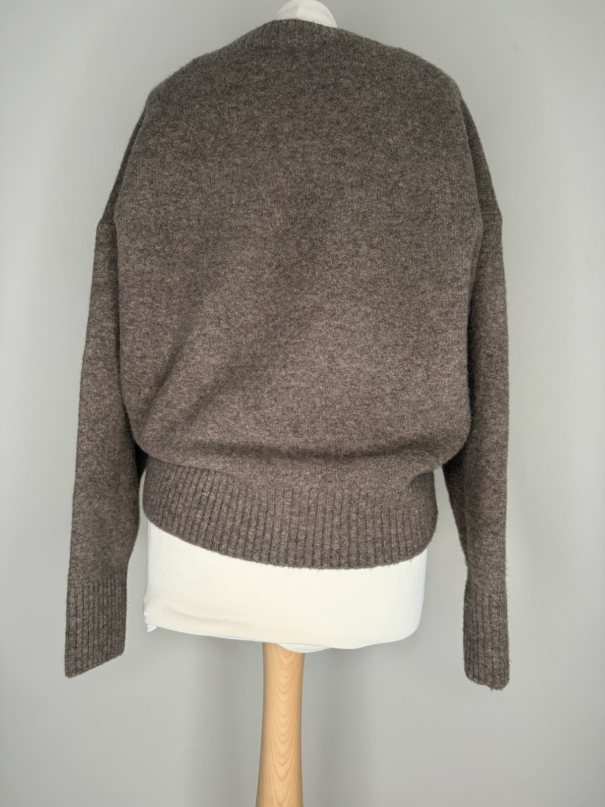 Style Reset relaxed fit brown knitted jumper with dropped shoulders and ribbed hem, back view on a mannequin.