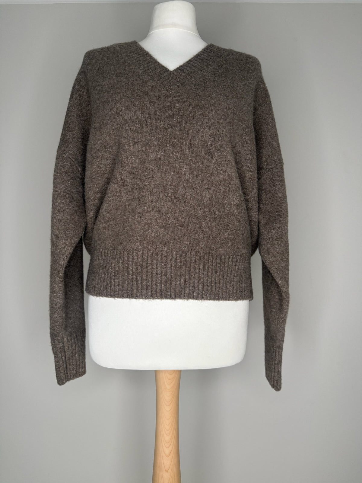 Style Reset relaxed fit brown V-neck knitted jumper with ribbed cuffs and hem on a mannequin
