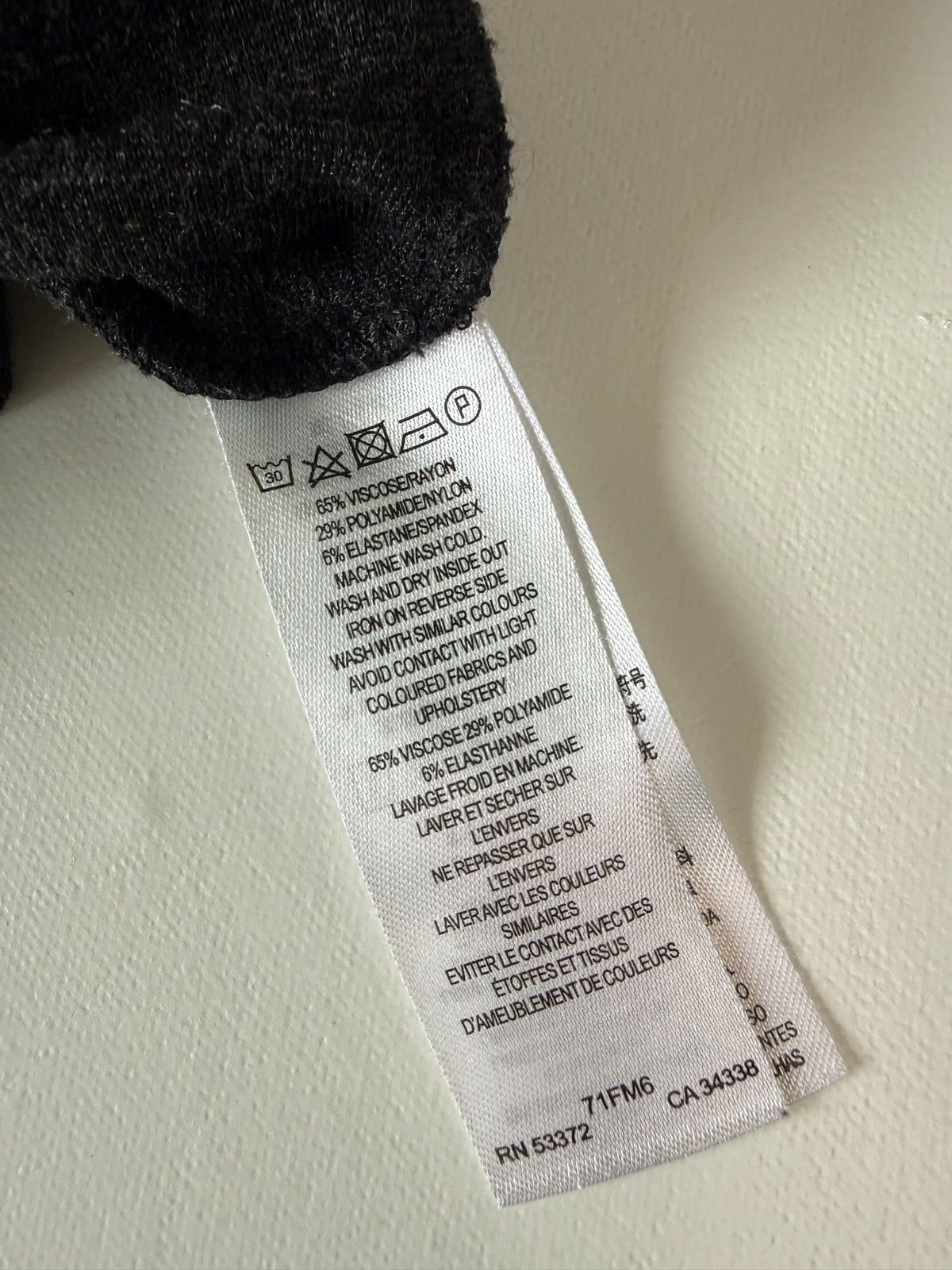 Style Reset French Connection dress fabric care label showing material composition and washing instructions