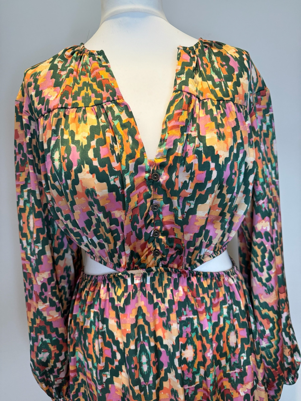 Style Reset long sleeve maxi dress in a multi-coloured geometric print with a V-neck, button detail and waist cut-out