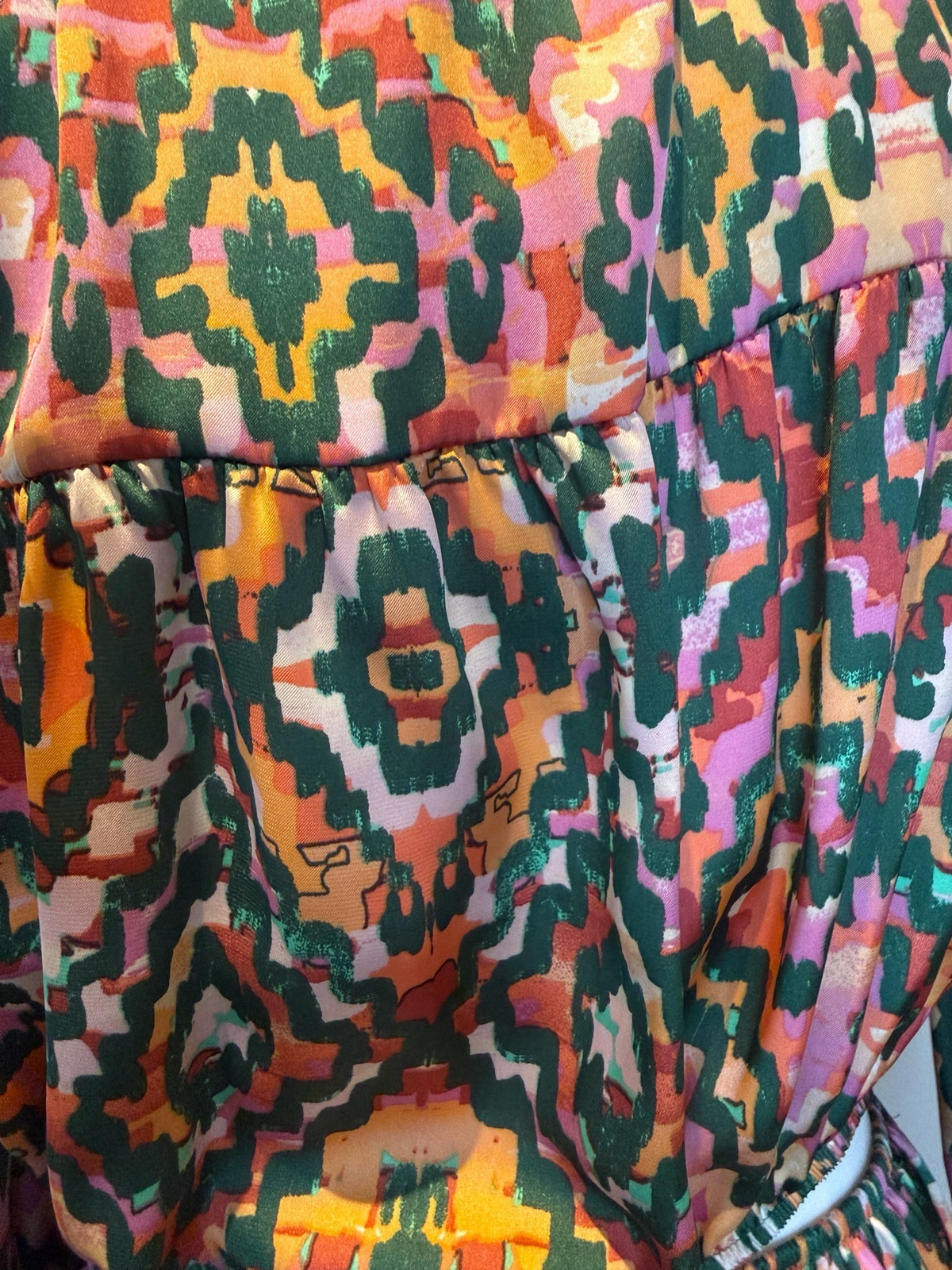 Style Reset maxi dress featuring a vibrant multi-coloured geometric print in green, orange, and pink on silky fabric