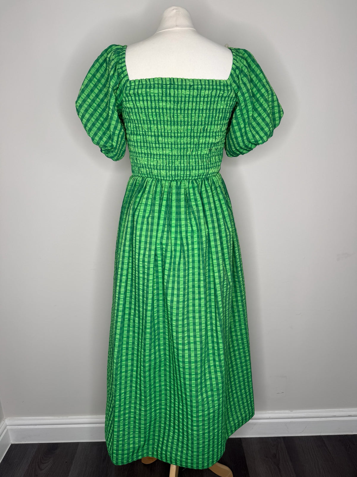 Style Reset green gingham midi dress with smocked bodice, square neckline, and puff sleeves on a mannequin