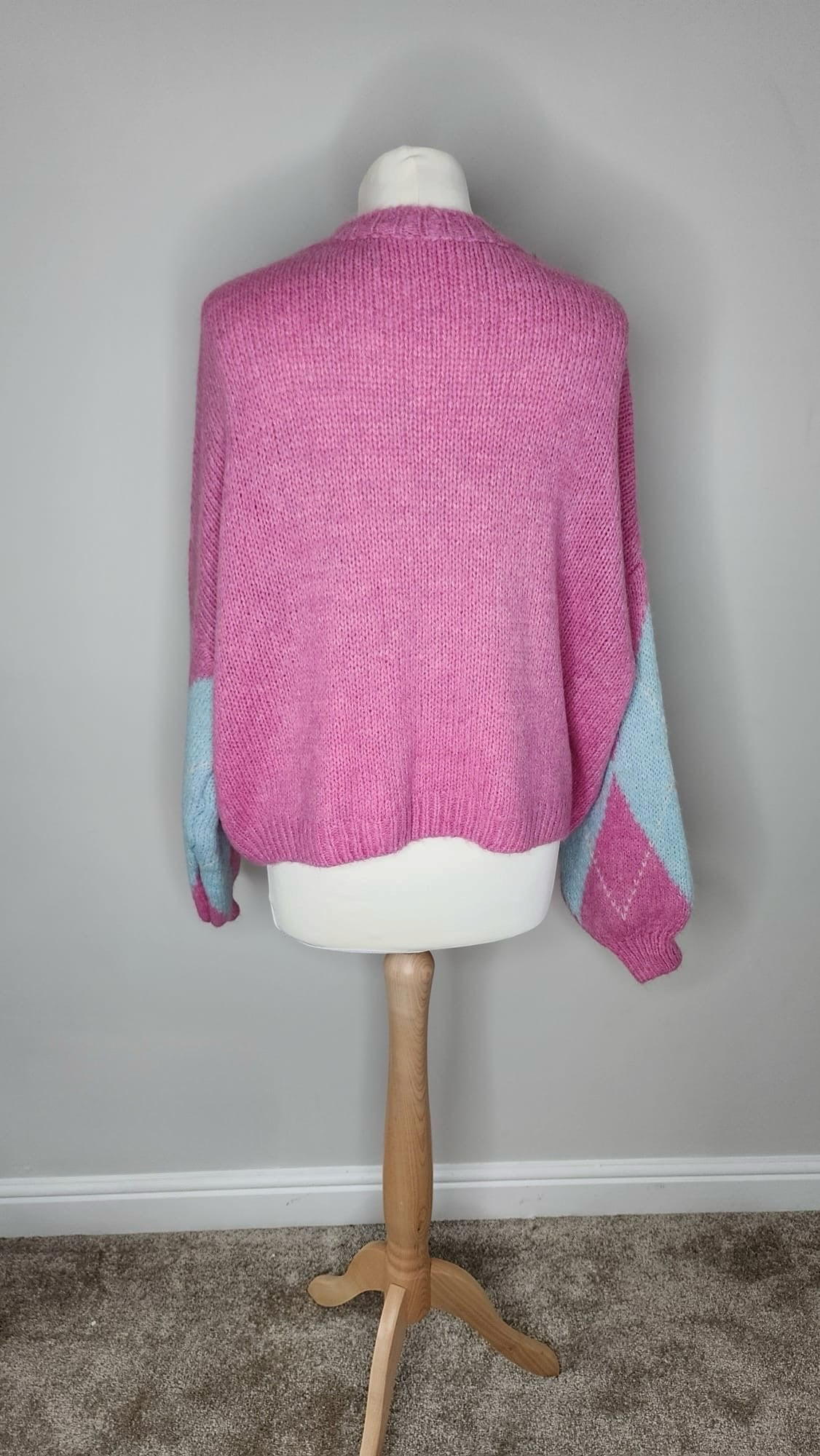 Style Reset LOVIKA Paris pink and blue argyle knitted jumper with ribbed crew neck on a mannequin, back view.