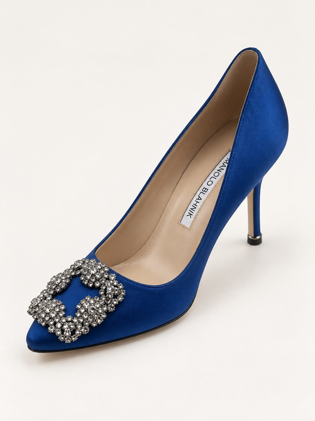 Style Reset Manolo Blahnik royal blue satin stiletto court shoes with a crystal-embellished buckle and pointed toe.