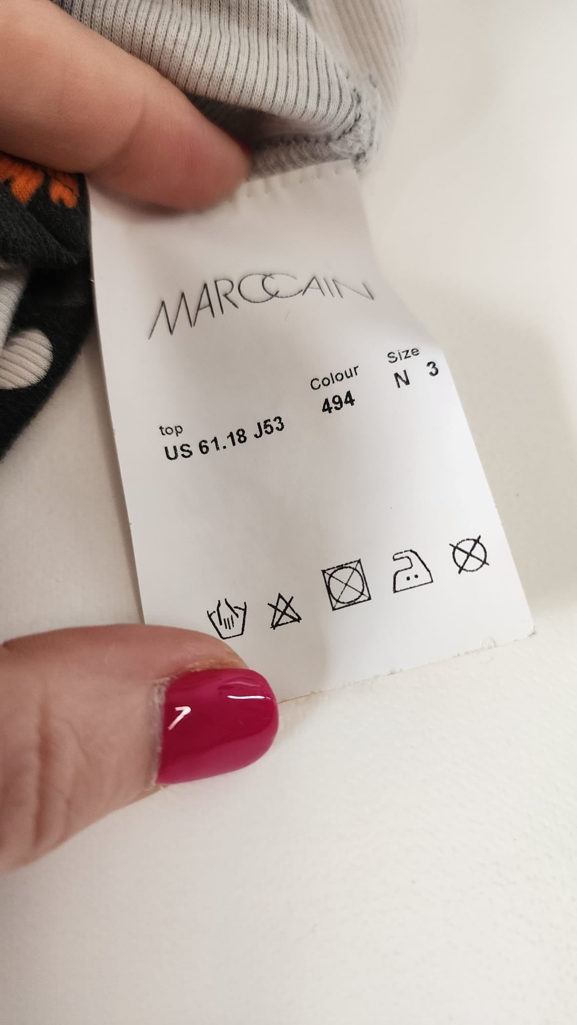 Style Reset Marc Cain dress care label showing brand logo, size N 3, colour 494, and garment washing instructions