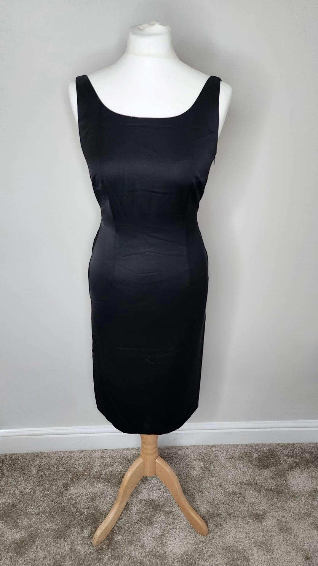 Style Reset black satin sleeveless midi dress by Moschino Cheap and Chic with a scoop neckline on a mannequin