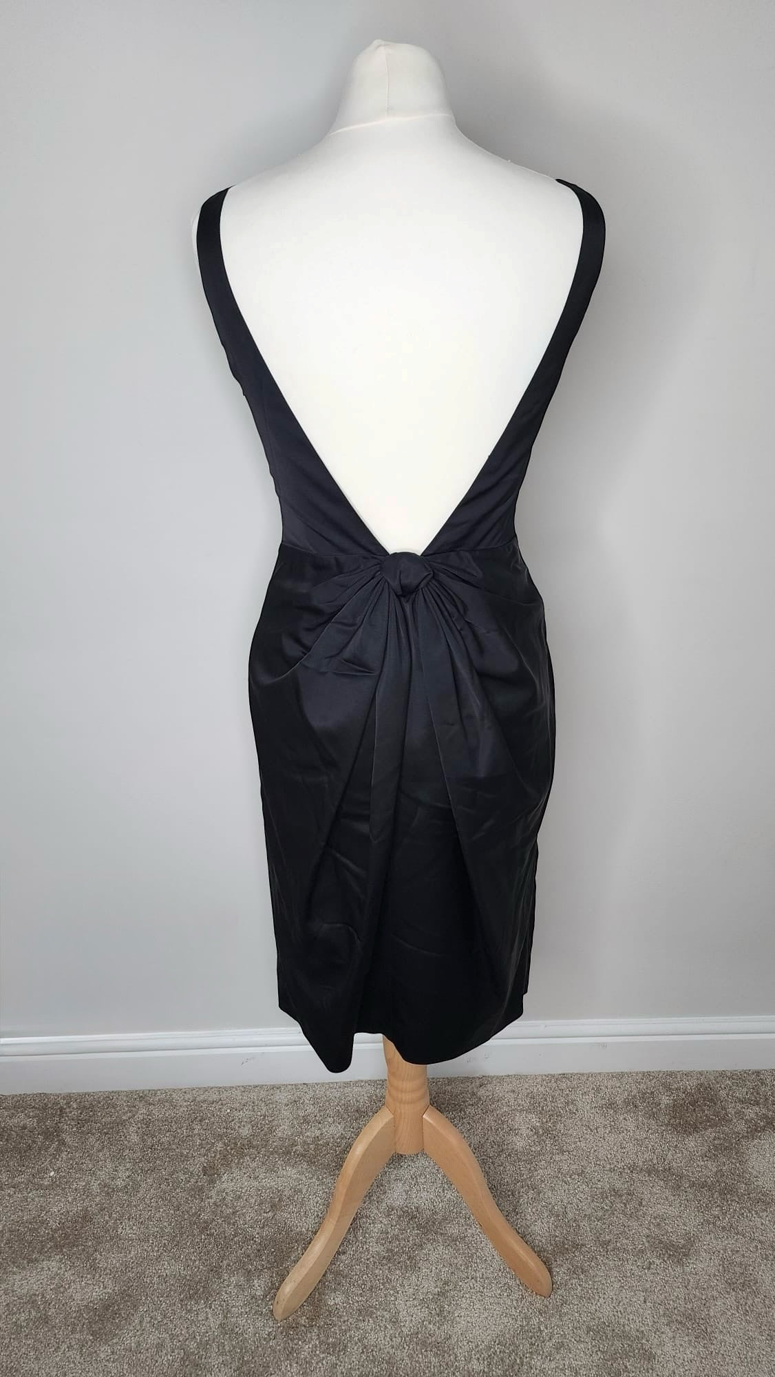 Style Reset black satin midi dress by MOSCHINO CHEAPANDCHIC featuring a deep open back with a gathered knot detail.
