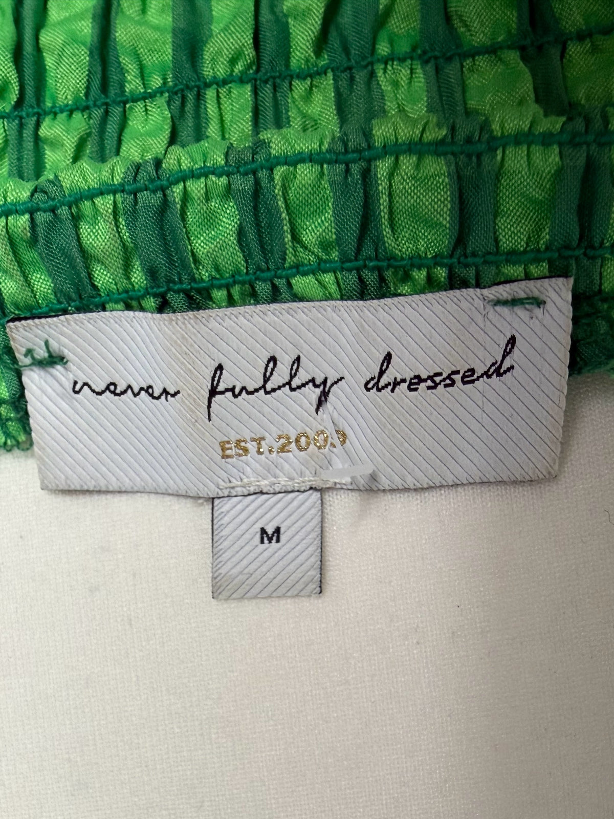 Style Reset never fully dressed green gingham midi dress brand label and size M tag on smocked fabric