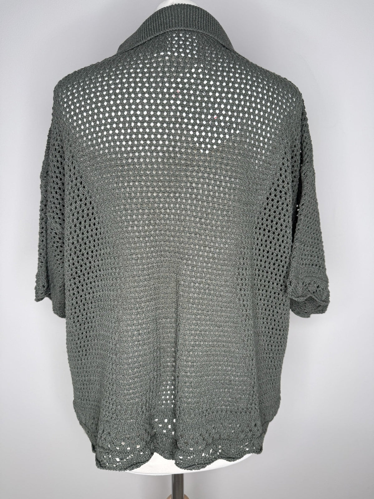 Style Reset olive green open-knit cardigan with a relaxed fit, collar, and intricate crochet-style texture.