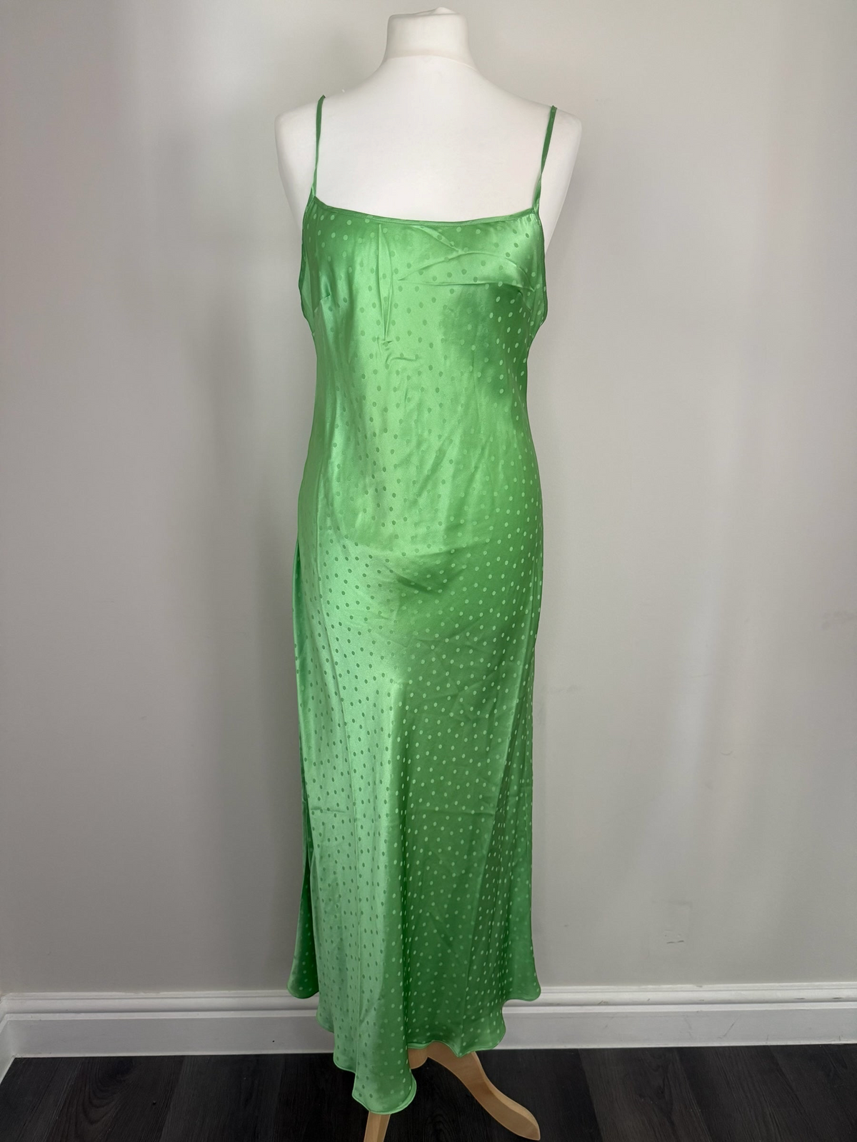 Style Reset RIXO green silk slip maxi dress with tonal polka dot jacquard pattern and delicate spaghetti straps.