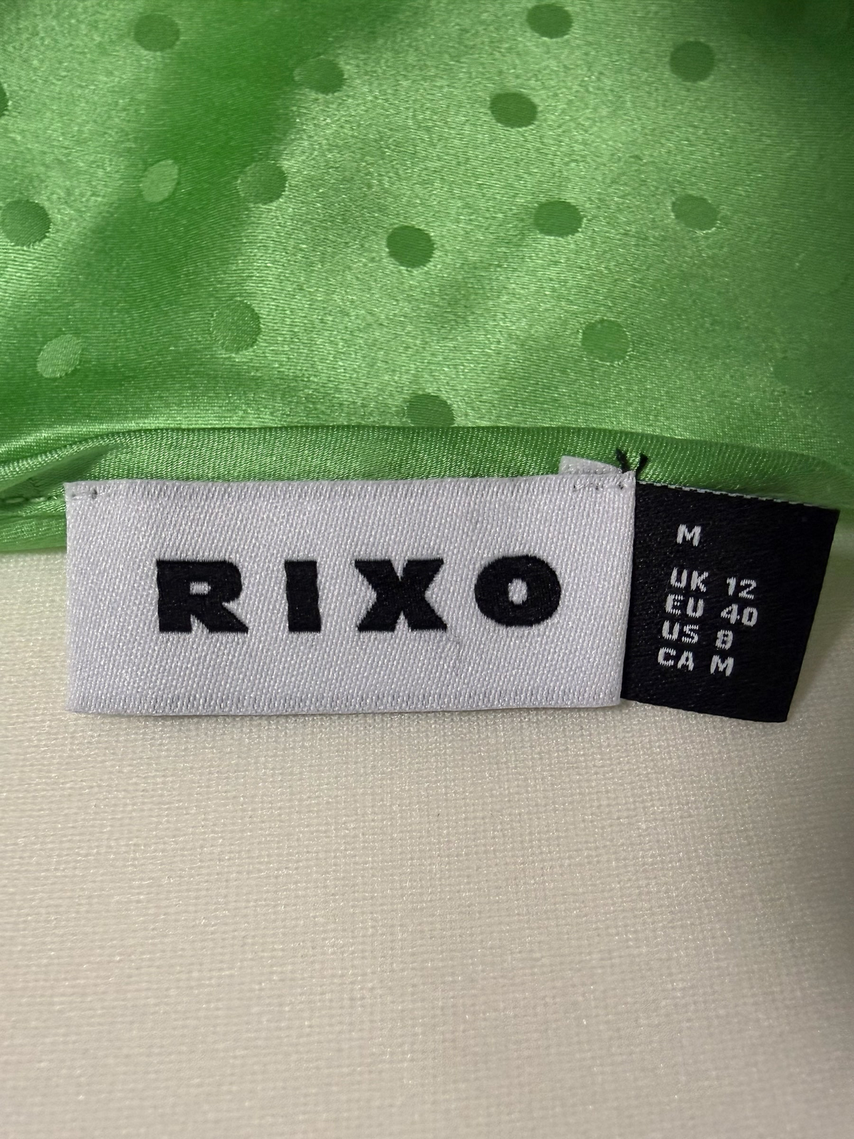 Style Reset RIXO green silk slip dress label showing size medium and brand logo