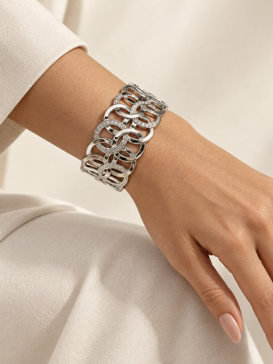 Style Reset silver-tone wide cuff bracelet featuring an interlocking circular pattern with sparkling crystal accents.