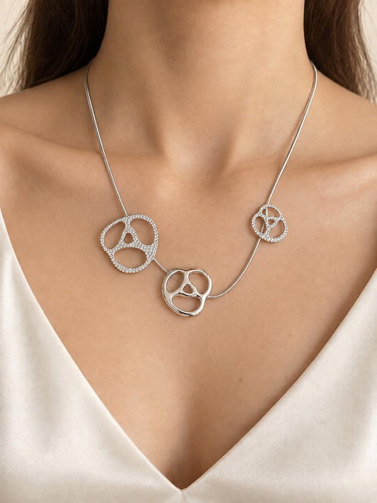 Style Reset Swarovski silver-tone statement necklace featuring three abstract organic pendants with pavé-set crystals.