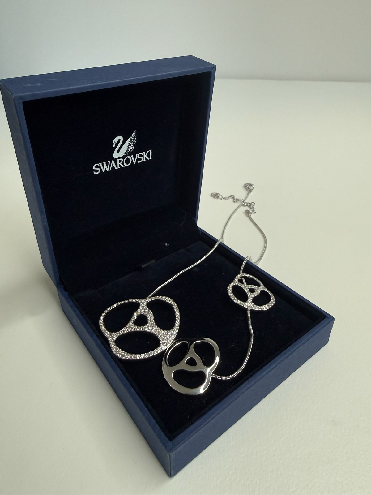 Style Reset Swarovski silver-tone statement necklace with three abstract crystal-pave pendants in a blue gift box