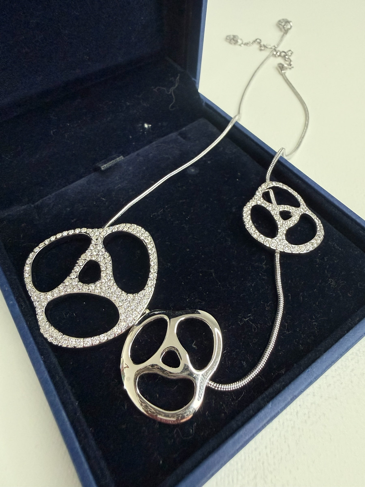 Style Reset Swarovski silver-tone statement necklace with three abstract crystal-pave pendants in a blue gift box