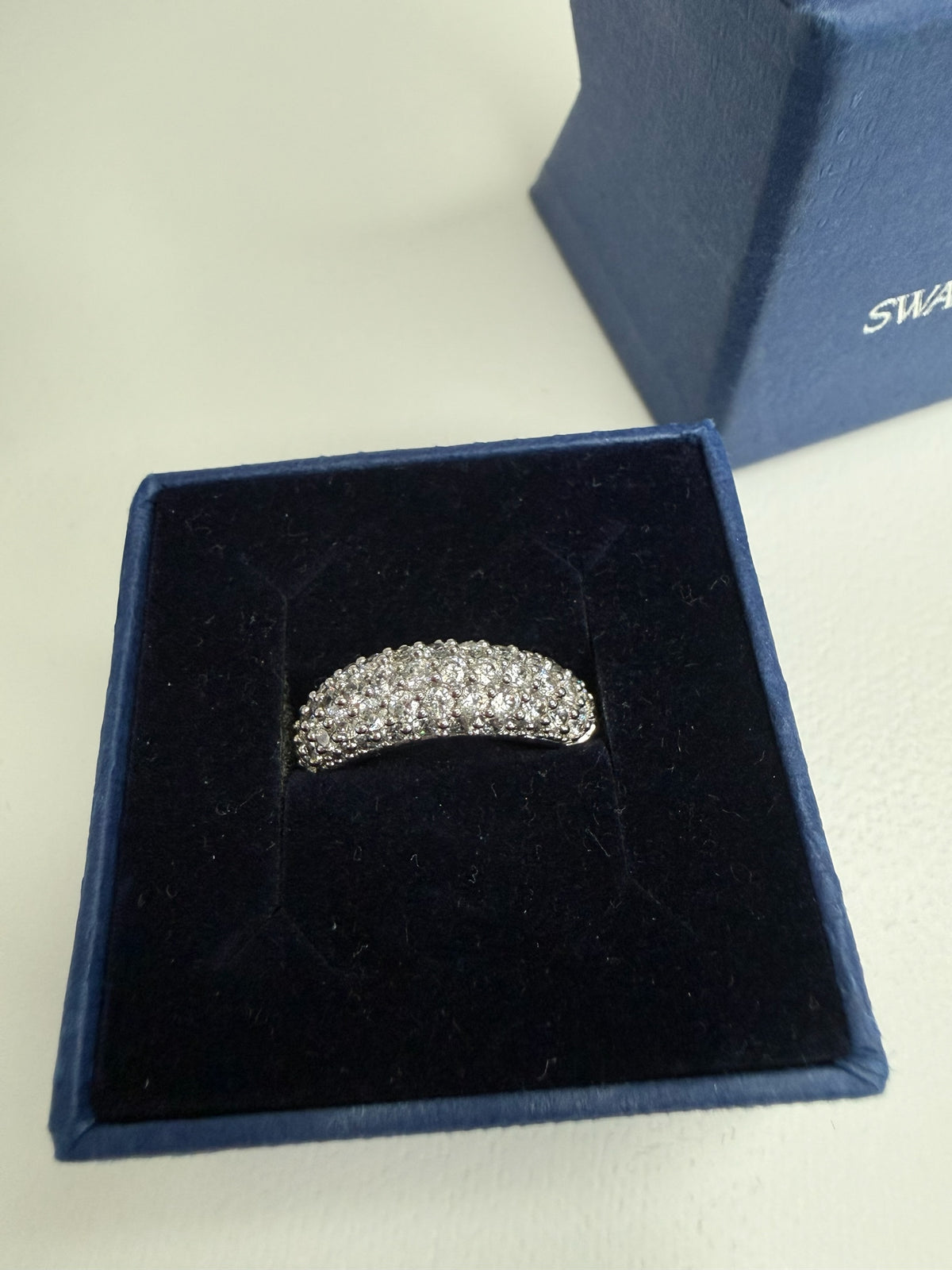 Style Reset dome-shaped Swarovski pavé crystal ring with a polished silver-tone finish in a blue velvet gift box