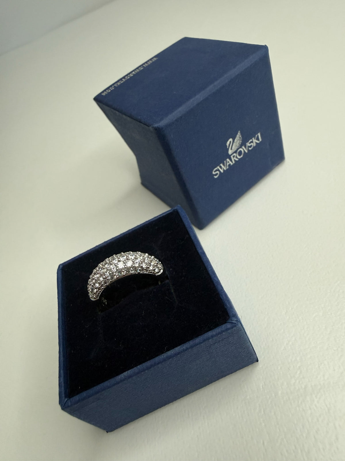 Style Reset Swarovski dome-shaped pavé crystal ring in a silver-tone finish displayed in its signature blue gift box.