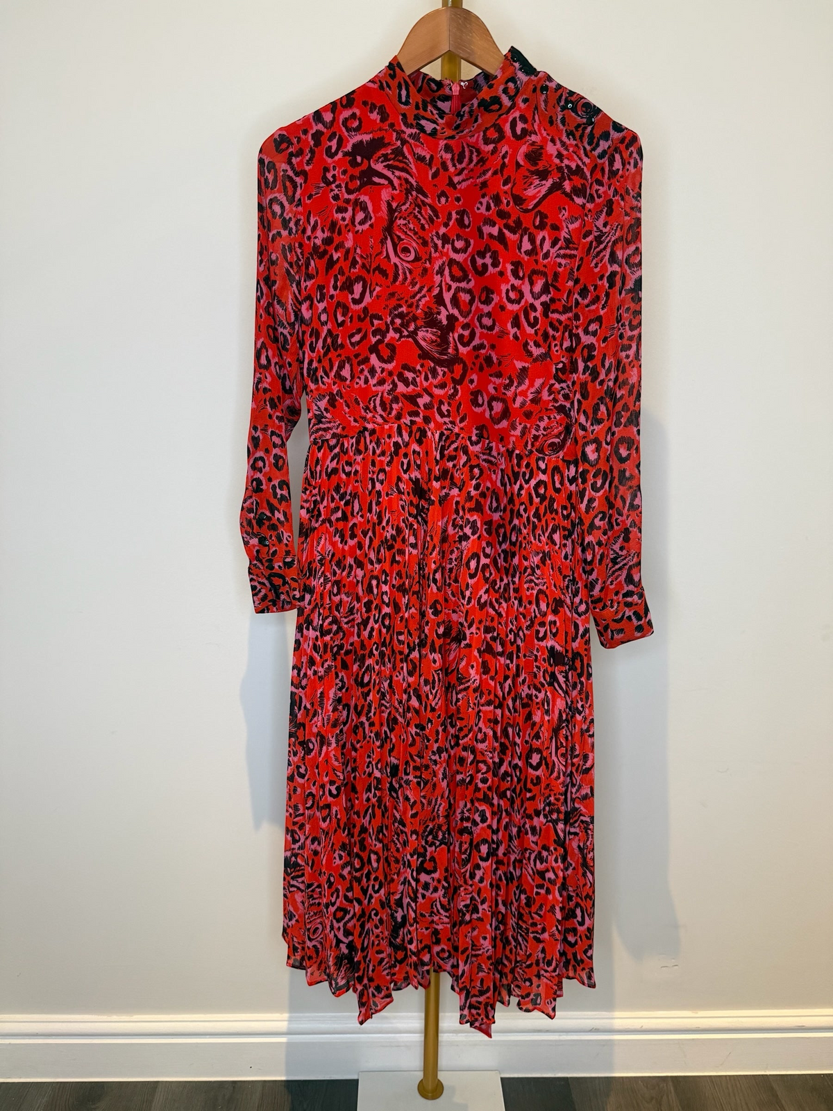 Style Reset WHISTLES red and black animal print long sleeve midi dress with a high neck and pleated skirt.